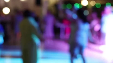 Silhouettes of people dancing at a night disco, no focus Stock Footage 345058461