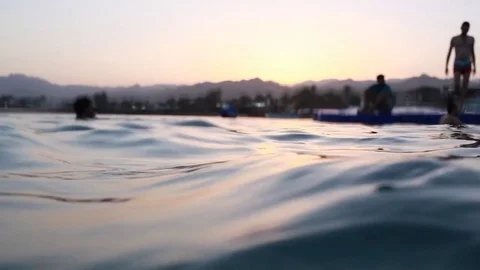Silhouettes of people diving, sunset, Egypt, Red Sea Stock Footage 82985916