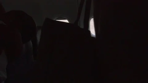Silhouettes of people getting off an airplane Stock Footage 158332248
