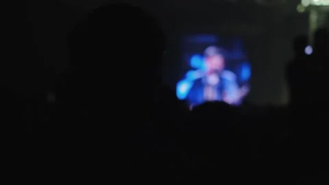 Silhouettes of people jumping, waving, taking photos or recording videos of a li Video stock 258345106