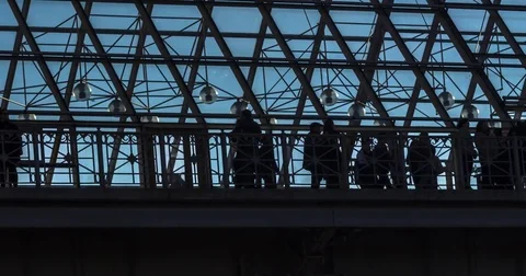 Silhouettes of people strolling inside the transparent transition, time lapse Stock Footage 75752113