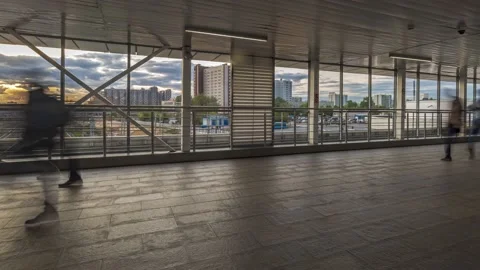 Silhouettes of people strolling inside the transparent transition, time lapse Stock Footage 144223339