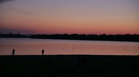 Silhouettes of people at sunset Stock Footage 68079154