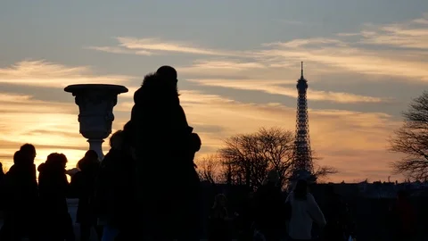 Silhouettes of People Walking in Front of Eiffel Tower At Sunset Stock Footage 109119334