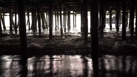 The silhouettes of the pillars under the pier; Stock Footage 234067509