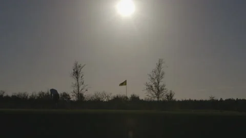 Silhouettes of Players on Golf Green Stock Footage 141081237