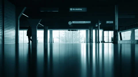 Silhouettes reflections of a group of people walking at airport terminal Stock Footage 264304332