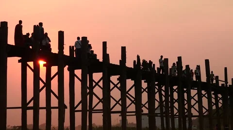 Silhouettes slow motion in U Bein bridge in Myanmar dolly shot Stock Footage 61205640