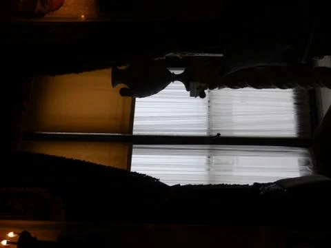 Silhouettes from soft lights inside an old mansion Stock Photos