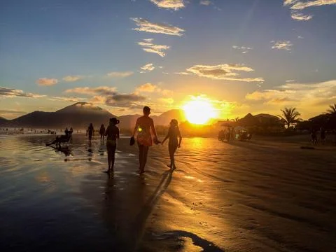 Silhouettes at Sunset Beach Stock Photos