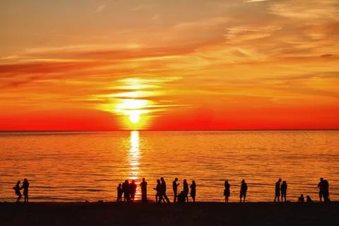 Silhouettes at sunset Stock Photos