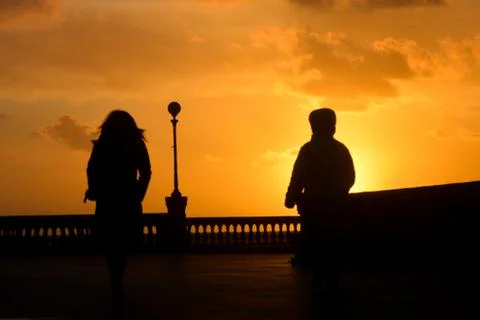 Silhouettes in the sunset Stock Photos