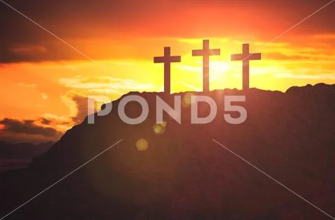 Silhouettes of three crosses at sunset on hill. Religion and christianity con Stock Photos