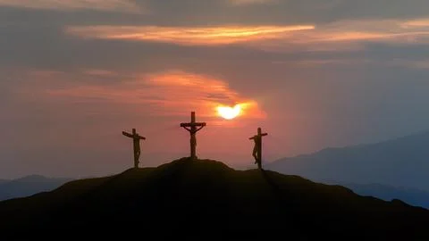 Silhouettes of three crosses at sunset Stock Photos