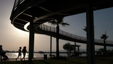 Silhouettes of tourists at sunset. Stock Footage 252152195