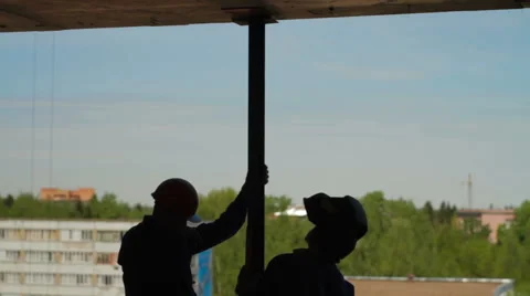 Silhouettes of two builders Stock Footage 57725110