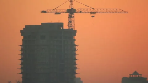Silhouettes two people in construction Stock Footage 96338690