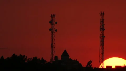 Silhouettes of two towers in sunset Stock Footage 104743494