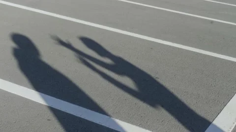 The silhouettes of two young men during angry conflict. HDR. Shadows of arguing Stock-Footage 165612664