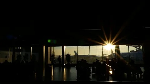 Silhouettes of unrecognizable Walking People in the Airport Stock Footage 70872053