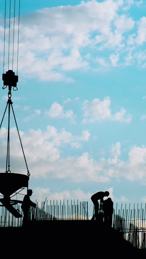 Silhouettes of Various Construction Sites Set Against a Beautiful Blue Sky Stock Footage 290191709