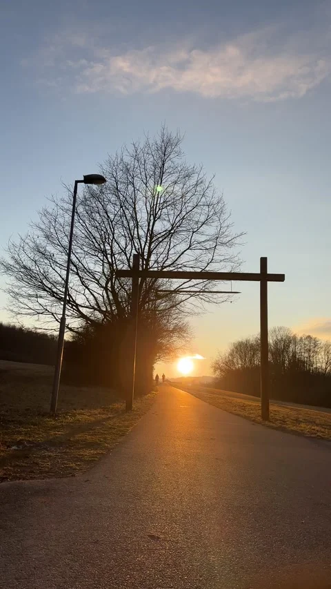 Silhouettes Walking on a Road at Sunset Stock Footage 303383108