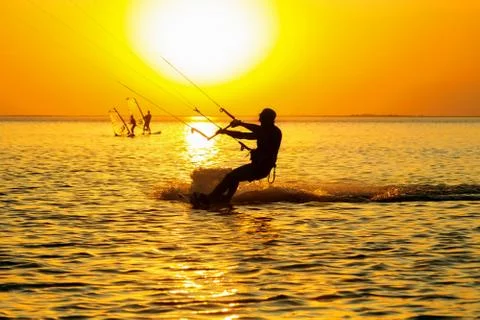 Silhouettes of a windsurfers Stock Photos