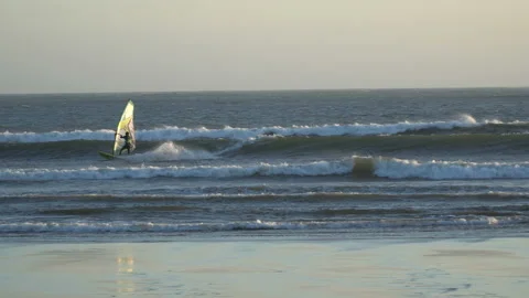 Silhouettes of windsurfers at the sunset. Spain Stock Footage 91270545