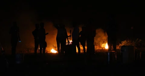 Silhouettes of workers at Campfire 스톡 동영상 339775982
