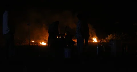 Silhouettes of workers at Campfire Stock Footage 339776041