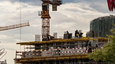Silhouettes of workers-installers on the construction of the building, time l Stock Footage 160341030