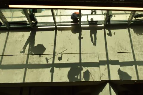 Silhouettes of workers Stock Photos