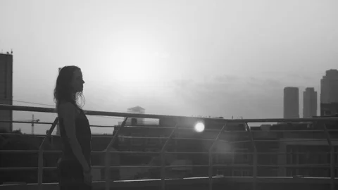 Silhouettes of young couple dancing on sunset Stock Footage 79164804