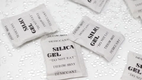 Silica gel beads and packets slowly rotating. Stock Footage 144000186