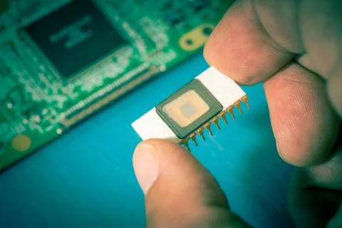 Silicon ceramic chip in the hand 스톡 사진