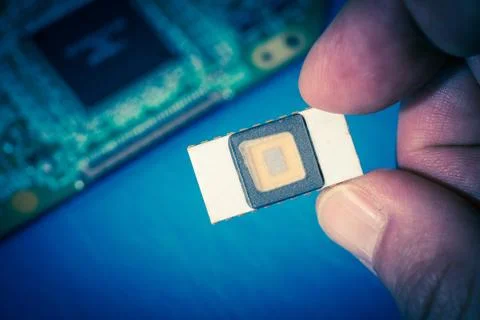 Silicon ceramic chip in the hand 스톡 사진
