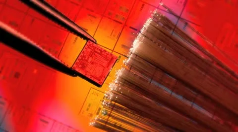 Silicon ic chip with wafer background and fiber optics Stock Footage 20545175