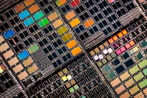 Silicon semiconductor wafer with integrated circuit die mosaic pattern. Stock Photos