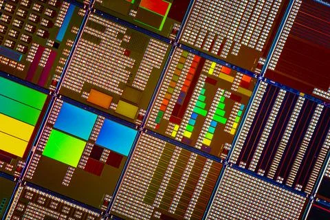 Silicon semiconductor wafer with integrated circuit die mosaic pattern. Stock Photos