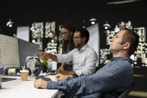 Silicon Valley startup office software developer relaxing at desk 스톡 사진