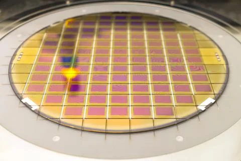 Silicon wafer with microchips fixed in the holder is on the chuck and ready f Stock Photos