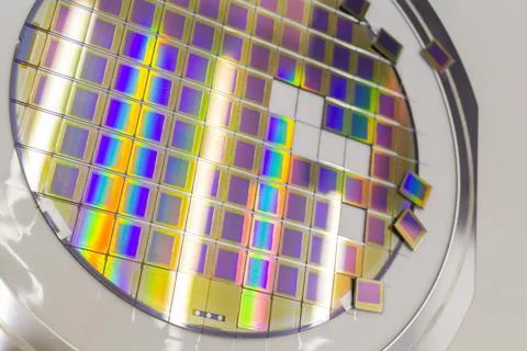 Silicon wafer with microchips fixed in a holder with a steel frame after the Stock Photos