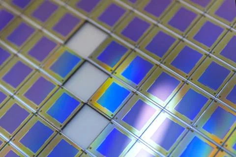 Silicon wafer with microchips fixed in a holder with a steel frame after the Stock Photos
