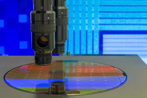Silicon wafer with semiconductor microchip on machine process examining testi Stock Photos