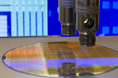 Silicon wafer with semiconductor microchip on machine process examining testi Stock Photos
