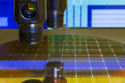 Silicon wafer with semiconductor microchip on machine process examining testi Stock Photos