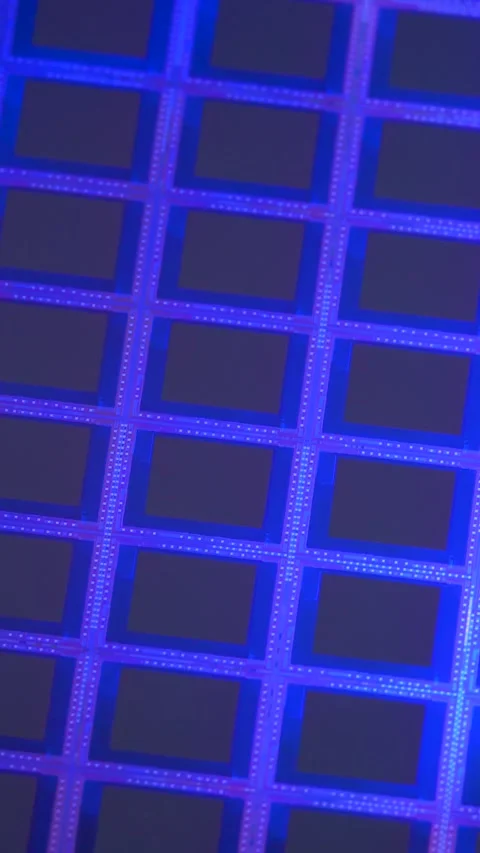 Silicon wafer substrate grid pattern reflect bright blue neon light Stock Footage 347732761