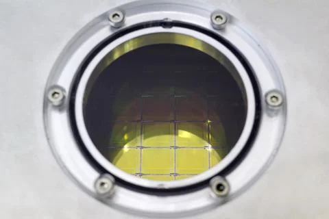 Silicon Wafers with microchips inside storage box, close up - A wafer is a th Stock Photos