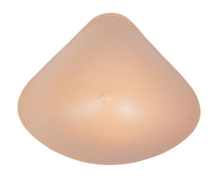 Silicone external breast prosthesis after mastectomy isolated on white back.. Stock Photos