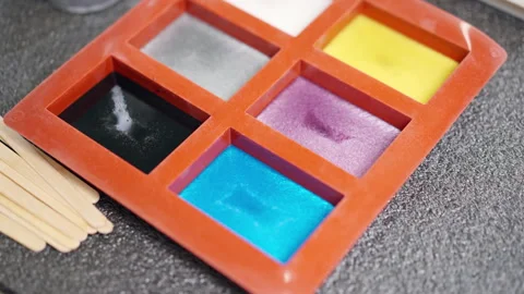 Silicone molds for epoxy resin samples in carpentry workshop, different pigment Stock-Footage 266170605